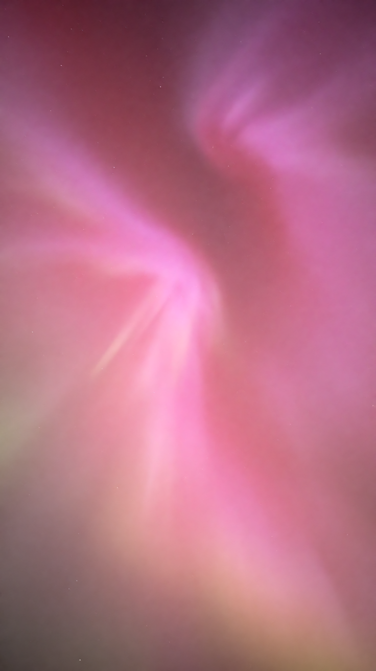 Pink aurora borealis night sky